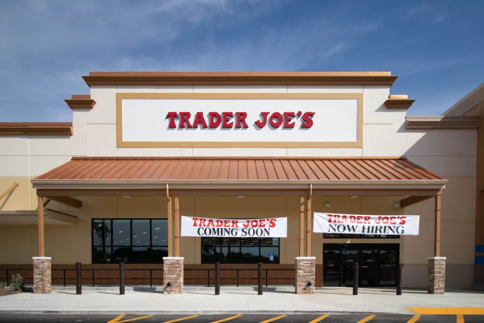 Trader Joe's building with "Coming Soon" and "Now Hiring" banners